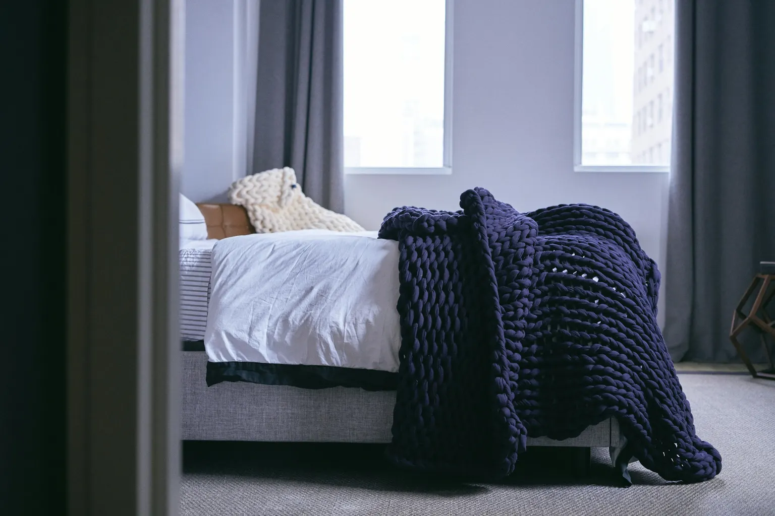 Two pillows and cases, Fitted sheet and protector (Photo: Bearaby on Unsplash)