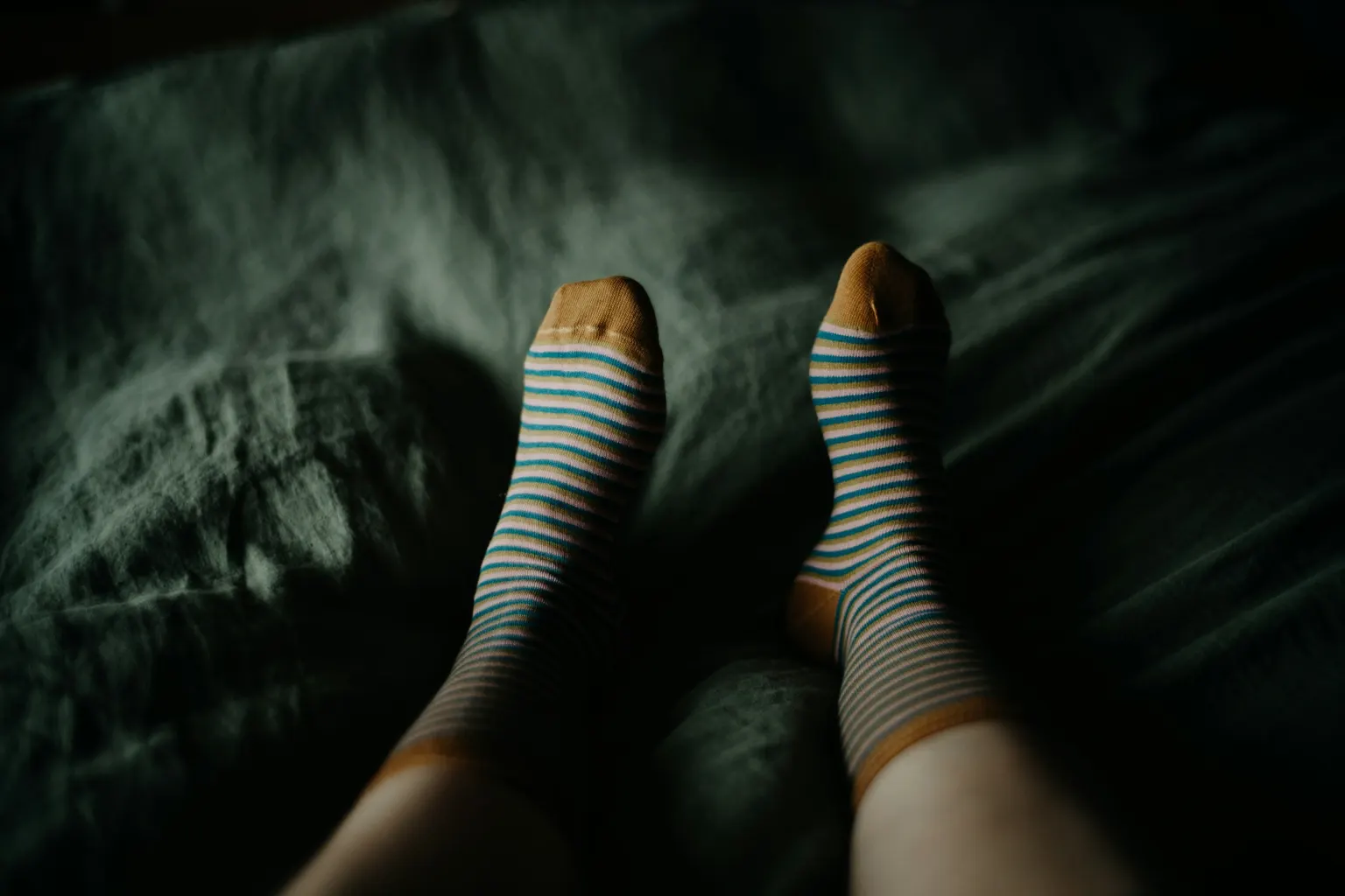 Thick wool-mix socks, Duvet, 10.5 tog, and cover (Photo: Annie Spratt on Unsplash)
